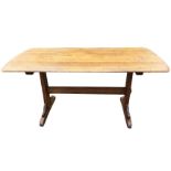 A rectangular dowel jointed oak refrectory table, the rectangular top with rounded ends on trestle