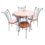 A wrought iron table & chair set, with scrolled decorative ironwork, having circular hardwood