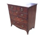 A Georgian mahogany chest of drawers with boxwood strung top above two short and three long