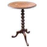 A nineteenth century circular mahogany occasional table, the moulded top on bobbin turned column