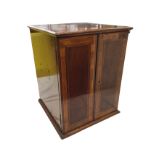 An Edwardian mahogany cabinet with crossbanded doors framed by boxwood & ebony stringing. (13in x