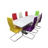 A contemporary extending dining table and chair set, the rectangular table with spare leaf on