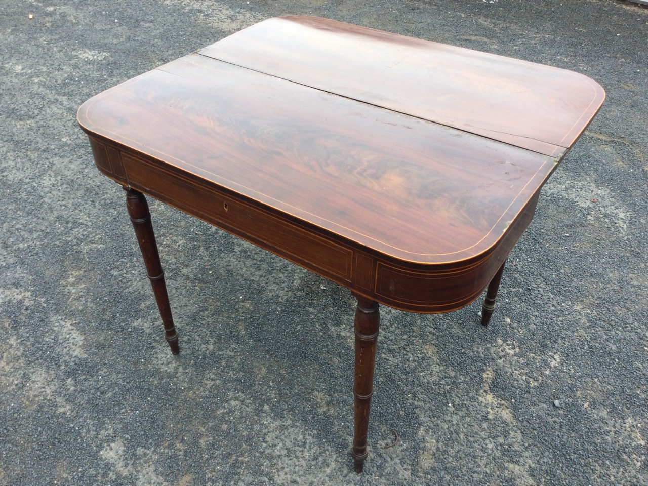 A nineteenth century mahogany turn-over-top tea table inlaid with boxwood stringing, the rounded - Image 2 of 3