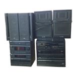 A JVC music system with cassette player, amplifier, radio tuner, CD player and labyrinth speakers;