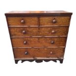 A nineteenth century oak chest of drawers with two short and three long graduated drawers mounted