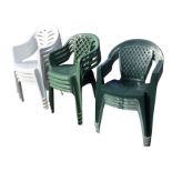 Three sets of four stacking garden armchairs with rounded backs and triangular legs. (3 x 4)