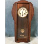 A Vienna style mahogany cased wallclock with enamelled dial and roman chapters framed by brass