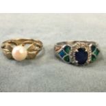 A gold ring set with large single pearl in a pierced flowerhead style mount with brushed finish