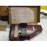 A Japanese made Spanish guitar, the Sierra model distributed by Selma; and a boxed autoharp. (2)