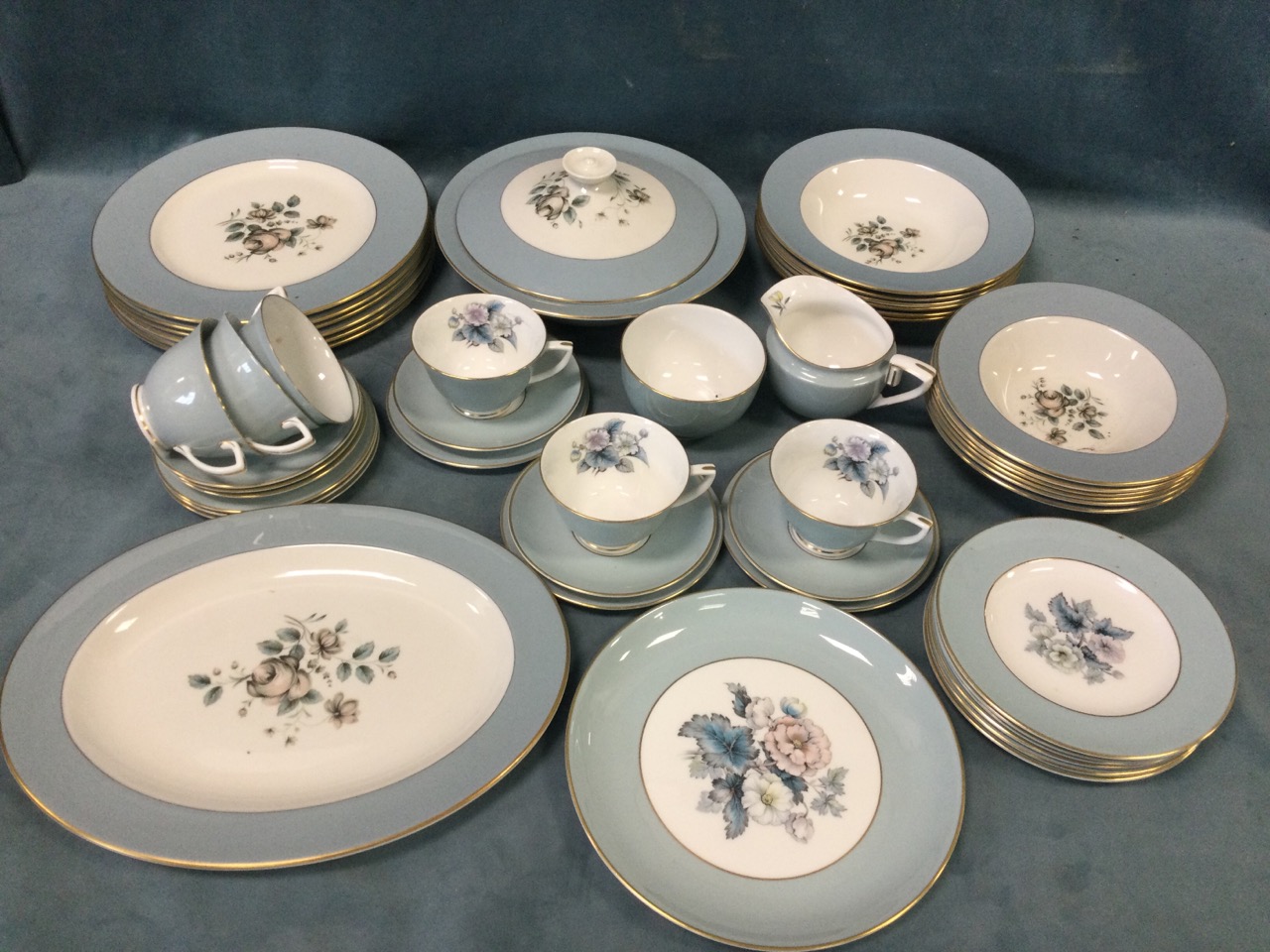 A Royal Worcester dinner/breakfast service decorated in the woodland pattern with duck-egg blue