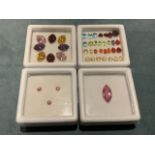 A boxed collection of eight loose multicoloured marquee-cut cubic zirconia stones; a boxed