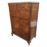 A walnut chest of drawers with plate glass to rectangular moulded top, having two short and four