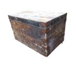 A painted dovetailed pine box with hinged lid, fitted with metal mounts, raised on castors. (40in