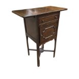 A stained occasional table with drop-leaves to top above a panelled frieze drawer and cupboard,