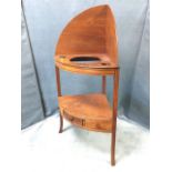 A nineteenth century mahogany corner washstand with shaped back above bowfronted platform pierced