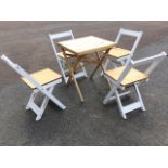 A folding garden table & chair set, with square pine table and four white painted chairs having