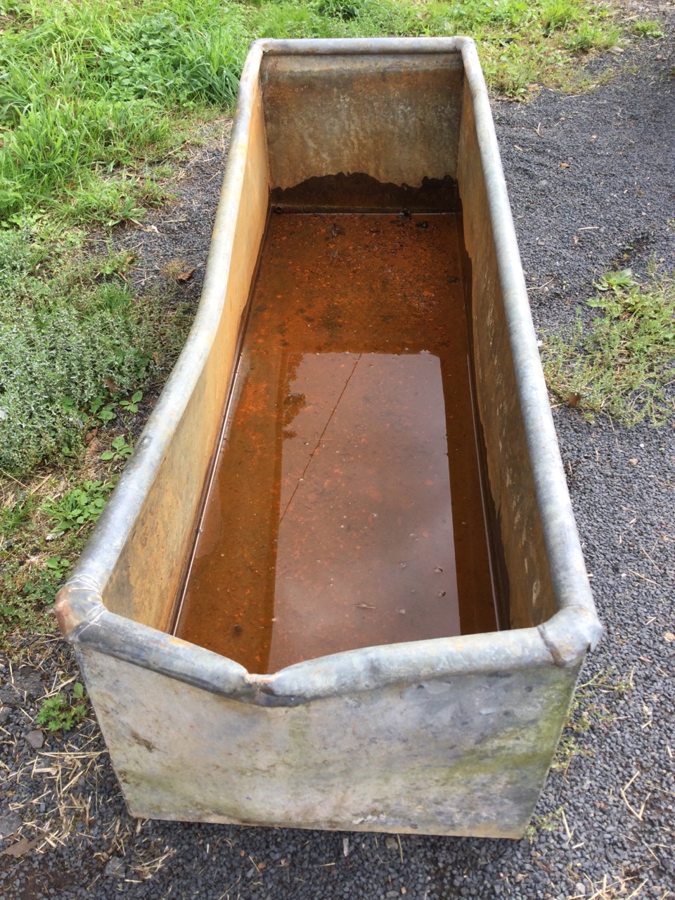 A rectangular galvanised trough with tubular rim. (62in x 19.25in x 16.25in) - Image 2 of 3