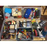 Various boxes of tools and DIY materials including pumps, cables, screws, plastering floats,