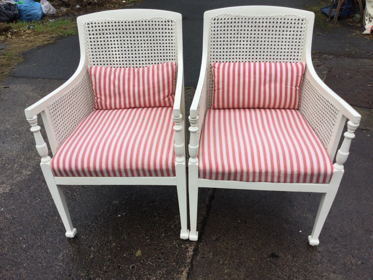 A pair of painted bergere armchairs with cane backs and sides, the downswept arms on baluster turned - Image 2 of 3