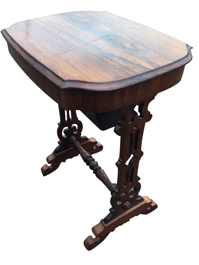 A Victorian rosewood sewing table, the shaped moulded top having frieze drawer with fitted well,