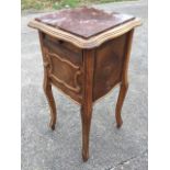 A Louis XVI style oak bedside cabinet with rouge marble slab top above a panelled drawer and