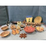 Miscellaneous treen & canework including a singed leopard, bowls, shoe trees, cane baskets, a