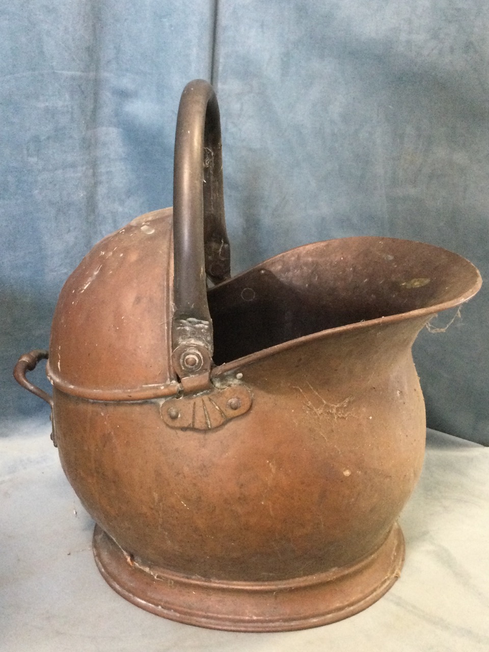 A Victorian helmet shaped copper coal skuttle with serpent cast swing handle, raised on claw feet; - Image 2 of 3