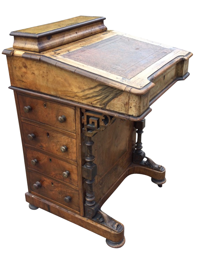 A Victorian walnut davenport inlaid with satinwood banding, the desk with tooled leather skiver to