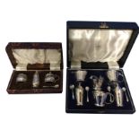 A cased hallmarked silver three-piece Walker & Hall cruet set - Birmingham, 1950, with circular