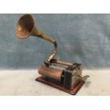 A late Victorian clockwork phonograph cylinder player, the working mechanism on cast iron plinth,