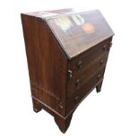 An inlaid Edwardian mahogany bureau, the fallfront revealing a fitted interior with central small