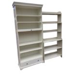 A contemporary painted open bookcase with six graduated shelves; and a white melamine unit with