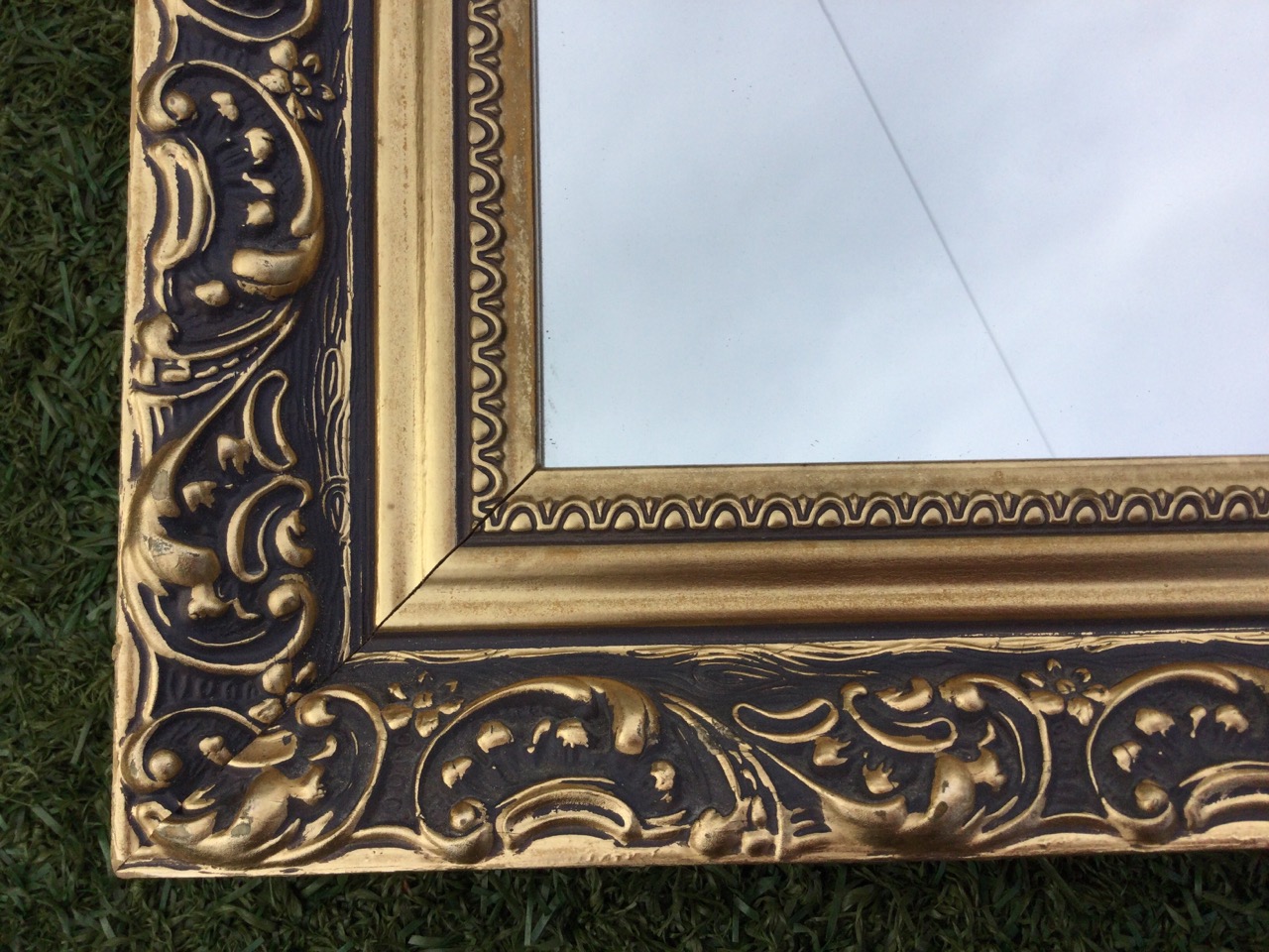 A gilt framed rectangular overmantel style mirror with canted top corners, the frame with foliate - Bild 2 aus 3