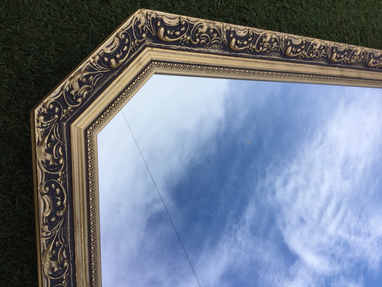 A gilt framed rectangular overmantel style mirror with canted top corners, the frame with foliate - Bild 3 aus 3