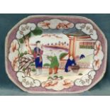 A nineteenth century Chinese stoneware platter decorated with three figures on garden terrace framed
