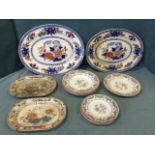 A graduated pair of Victorian Minton oval ashets having floral decoration framed by blue bands; a