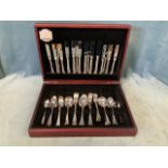 A boxed French canteen of stainless steel cutlery, eight settings - two spoons and servers