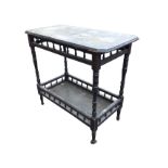 A Victorian ebonised side table with rectangular canted top above a frieze of gallery spindles,