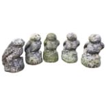 A parliament of five composition stone owls, the birds with mice in beaks all perched on fluted