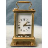 A German carriage clock by Schatz & Sohne, the five bevelled glass brass architectural style vase