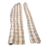 A pair of Prestigious Textiles thick cotton double width curtains, printed in burnt orange tartan on