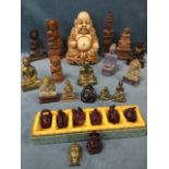 A collection of buddhas - carved, resin moulded, brass, soapstone, a boxed set of six, carved