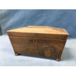 A nineteenth century rosewood tea caddy of sarcophagus form with tablet to hinged boxwood strung