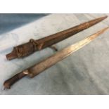 A nineteenth century sword with tapering steel blade having horn handle, the wood scabbard with iron