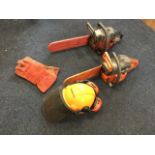 A Husqvana 42 petrol chainsaw; a Jonsered 2040 turbo chainsaw; and a safety helmet with gloves,