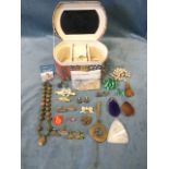 A jewellery box containing miscellaneous costume jewellery and cufflinks, a filigree brooch, faux