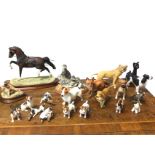A collection of ceramic animals - dogs, mainly Beswick, terriers, a lion, Royal Worcester, a fox,