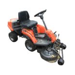 A Husqvana ride-on garden mower, model R111B5, the machine with twin rotary blades powered by rear