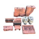 Nine cast terracotta architectural pieces - plinths, a fluted scrolled corbel, a fruit moulded