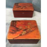 A graduated pair of Japanese lacquered boxes, the lids decorated with birds in landscape on orange